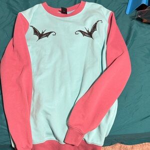 Pink and Blue Sweatshirt with Bat Design